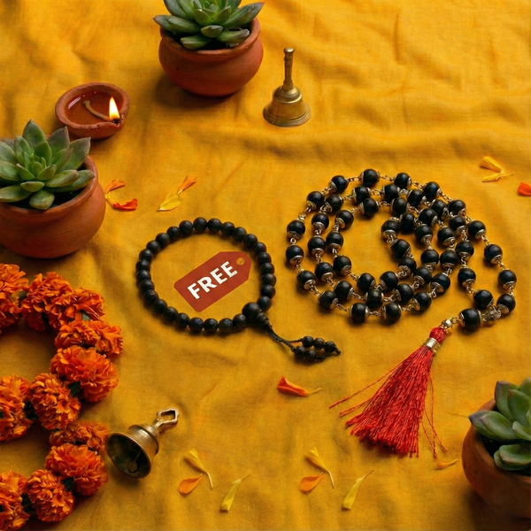Black beaded mala with a red 'FREE' label on a yellow fabric background with decorative elements.