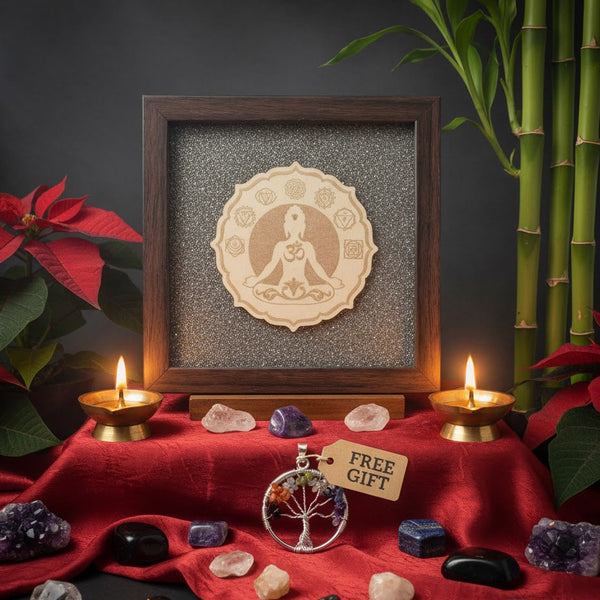 Decorative setup with framed artwork, candles, crystals, and a 'free gift' tag on a red cloth.