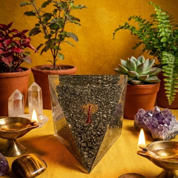 Decorative setup with crystals, stones, and plants on a wooden surface.